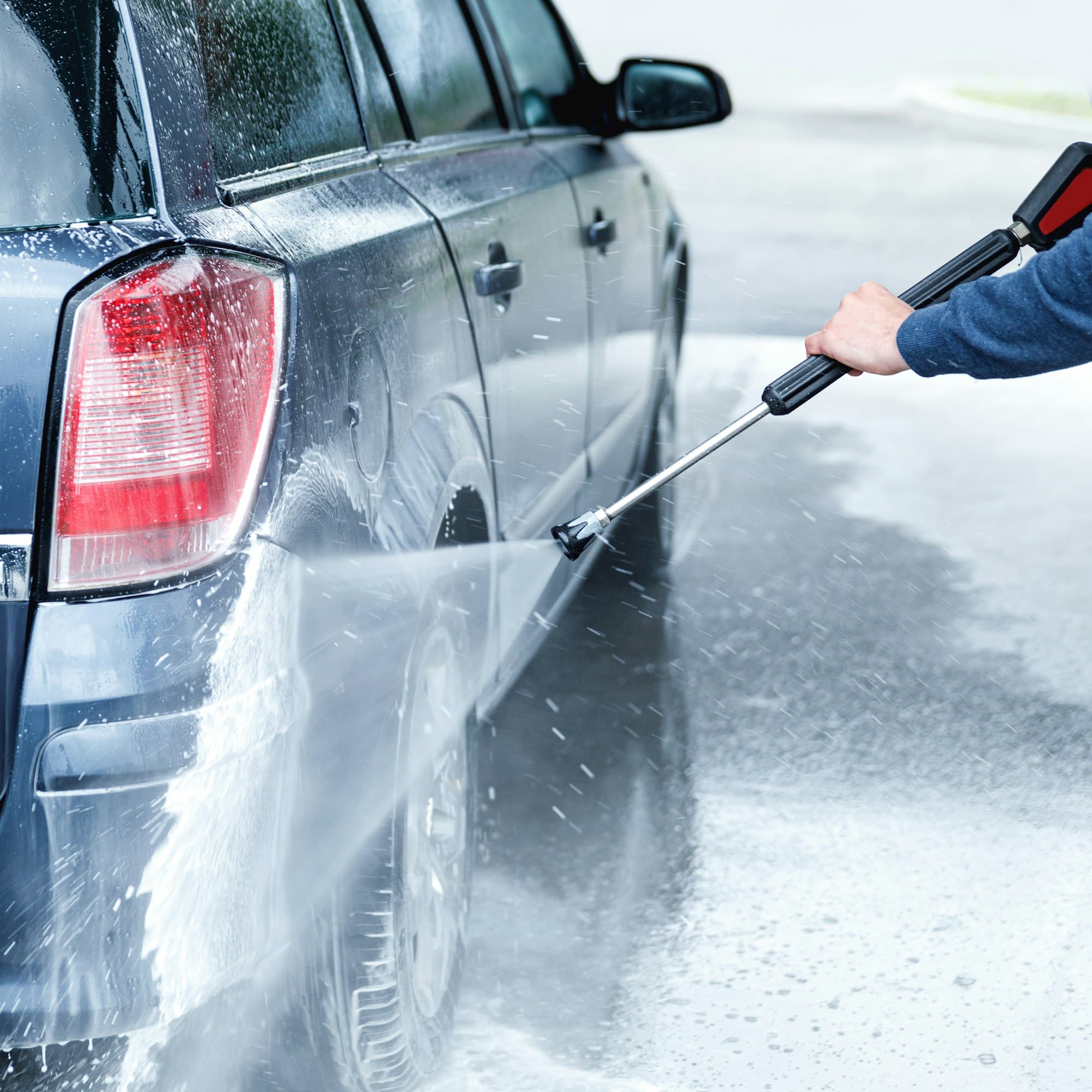 Carwash staff member serving a customer